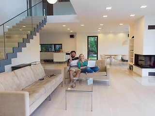 Image showing young happy couple relaxes in the living room