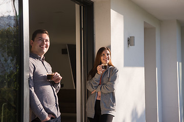 Image showing couple enjoying on the door of their luxury home villa