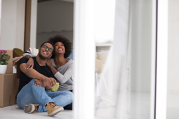 Image showing African American couple relaxing in new house