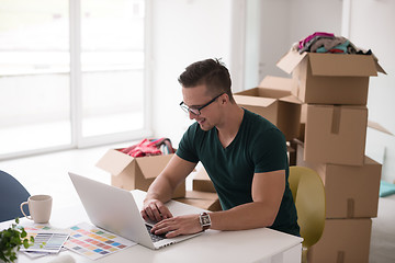 Image showing Young man moving in a new home