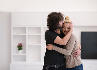 Image showing couple hugging in their new home