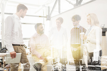 Image showing happy business team drinking coffee at office