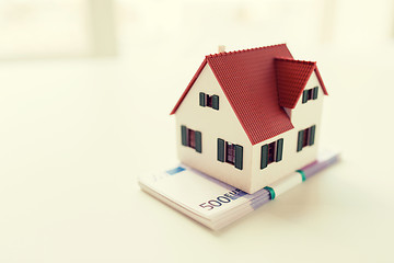 Image showing close up of home or house model and money