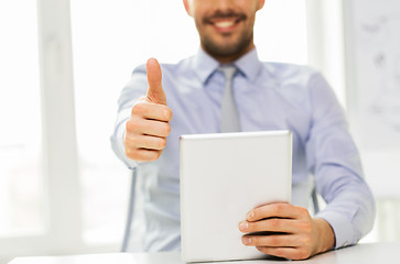 Image showing businessman with tablet pc showing thumbs up