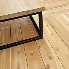 Image showing Simple table on wooden floor