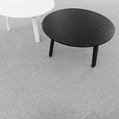 Image showing Round black and white tables on carpet floor