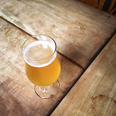 Image showing Glass of unfiltered beer on a bar table