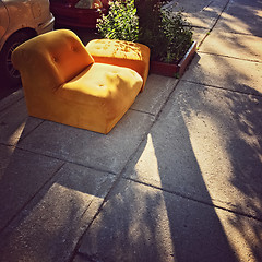 Image showing Abandoned orange sofa on the street