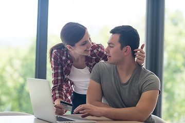 Image showing happy young couple buying online