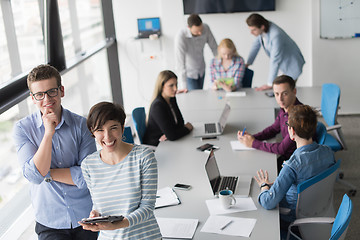 Image showing Two Business People Working With Tablet in office