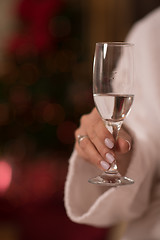 Image showing woman drinking champagne at spa