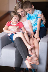 Image showing Young Family Using A Tablet To Make Future Plans