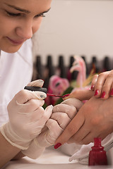 Image showing Woman hands receiving a manicure