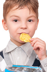 Image showing Little boy with packet potato chips