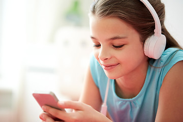 Image showing close up of girl with smartphone and headphones