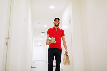 Image showing man delivering coffee and food to customer home