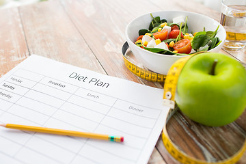 Image showing close up of diet plan and food on table