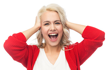 Image showing happy young woman holding her head and laughing