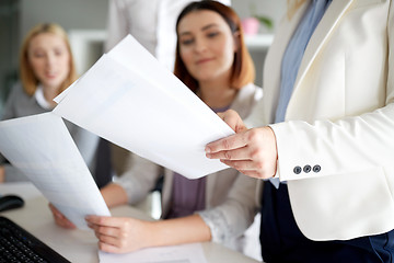 Image showing businesswomen with papers in office