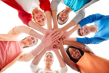 Image showing international group of women with hands together