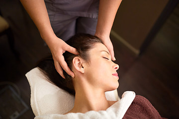 Image showing woman having head massage at spa