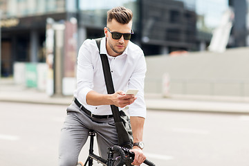 Image showing man with bicycle and smartphone on city street