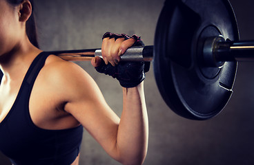 Image showing close up of woman with barbell in gym