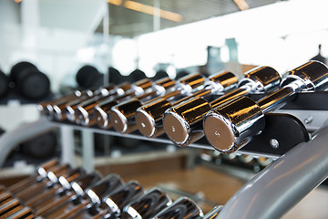 Image showing dumbbells and sports equipment in gym