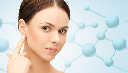 Image showing beautiful young woman face with molecules