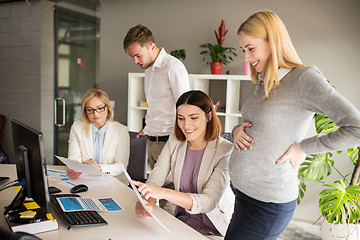 Image showing happy business team with papers in office