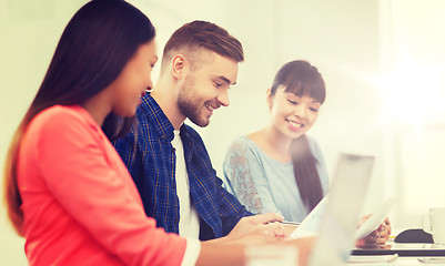 Image showing happy creative team or students working at office