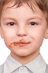 Image showing Little boy eating chocolate