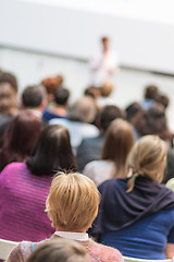 Image showing Woman giving presentation in lecture hall at university.