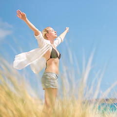 Image showing Free Happy Woman Enjoying Sun on Vacations.