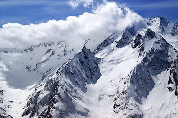 Image showing Winter snow mountains and blue sky with clouds in nice sun day