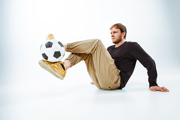 Image showing The portrait of fan with ball on gray background