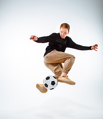 Image showing The portrait of fan with ball on gray background