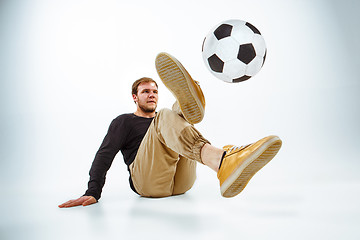 Image showing The portrait of fan with ball on gray background