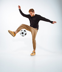 Image showing The portrait of fan with ball on gray background