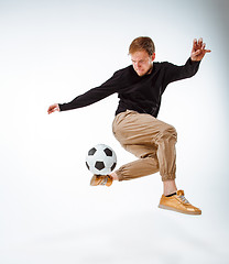 Image showing The portrait of fan with ball on gray background