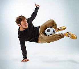 Image showing The portrait of fan with ball on gray background