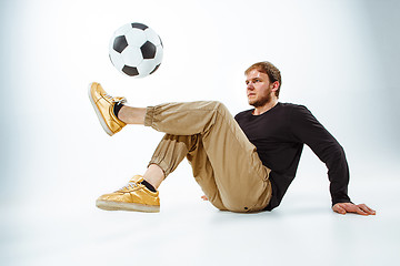Image showing The portrait of fan with ball on gray background