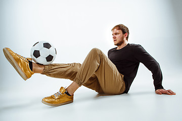 Image showing The portrait of fan with ball on gray background