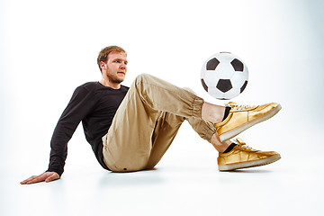 Image showing The portrait of fan with ball on gray background