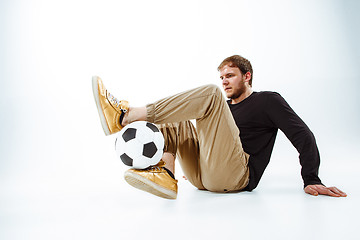 Image showing The portrait of fan with ball on gray background