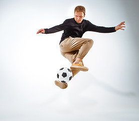 Image showing The portrait of fan with ball on gray background