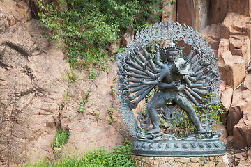 Image showing Tantric Deities statue in Ritual Embrace located in a mountain g