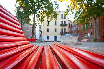 Image showing Venice from a red bench