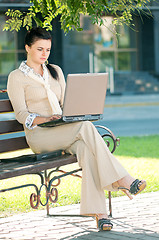 Image showing Business woman in summer park