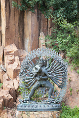 Image showing Tantric Deities statue in Ritual Embrace located in a mountain g